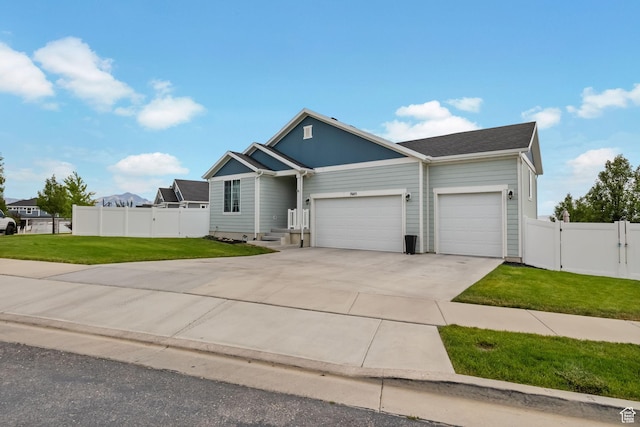 7603 S Scenic Maple Dr S, West Jordan, UT 84081 - view of front of property featuring an attached garage, driveway, and a gate