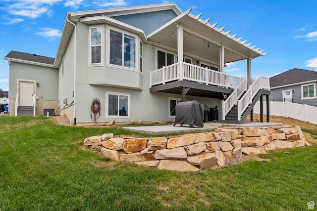 7603 S Scenic Maple Dr S, West Jordan, UT 84081 - rear view of house featuring a patio area, a wooden deck, stucco siding, and stairway