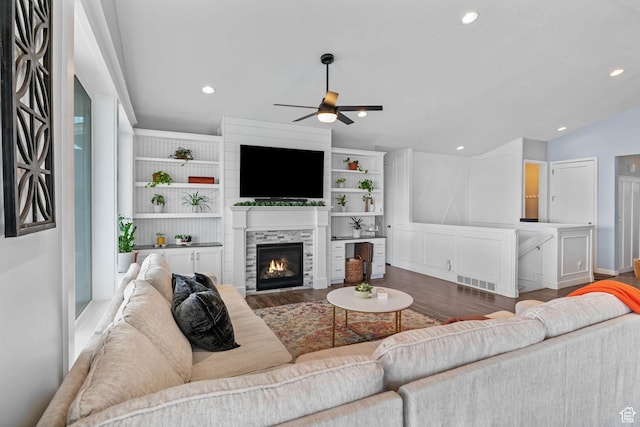 7603 S Scenic Maple Dr S, West Jordan, UT 84081 - living area with a ceiling fan, wood finished floors, a glass covered fireplace, recessed lighting, and lofted ceiling