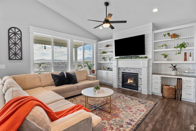 7603 S Scenic Maple Dr S, West Jordan, UT 84081 - living area featuring vaulted ceiling, ceiling fan, a glass covered fireplace, dark wood-style flooring, and recessed lighting