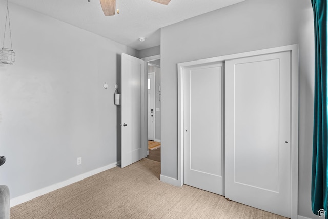 7603 S Scenic Maple Dr S, West Jordan, UT 84081 - unfurnished bedroom featuring light carpet, a closet, and ceiling fan