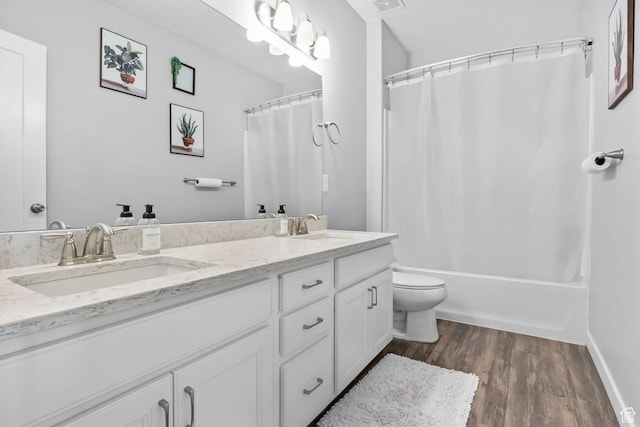 7603 S Scenic Maple Dr S, West Jordan, UT 84081 - bathroom featuring double vanity, wood finished floors, and shower / bath combo with shower curtain