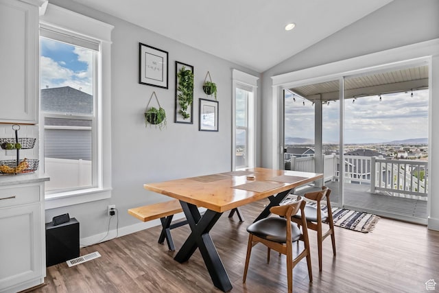 7603 S Scenic Maple Dr S, West Jordan, UT 84081 - dining area with healthy amount of natural light, wood finished floors, lofted ceiling, and recessed lighting