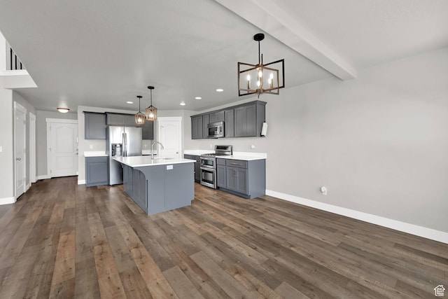 9602 N Blue Sky Dr, Eagle Mountain, UT 84005 - kitchen with stainless steel appliances, gray cabinetry, light countertops, recessed lighting, and a chandelier