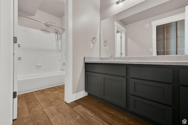 9602 N Blue Sky Dr, Eagle Mountain, UT 84005 - full bathroom featuring wood finished floors, double vanity, and washtub / shower combination