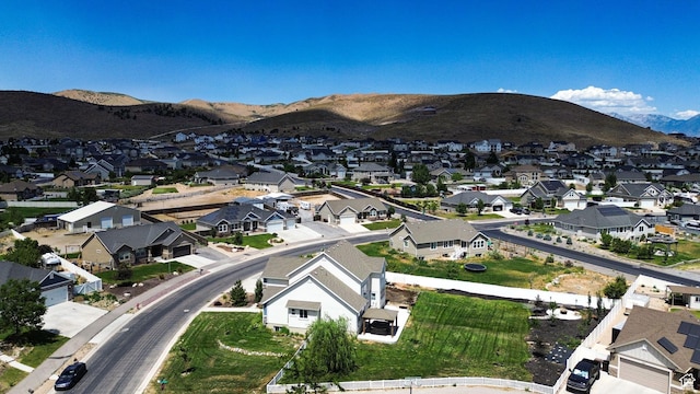 9602 N Blue Sky Dr, Eagle Mountain, UT 84005 - aerial view of property and surrounding area featuring nearby suburban area and a mountainous background