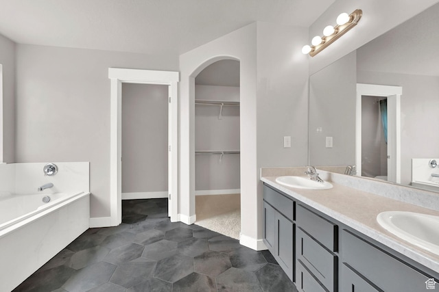 9602 N Blue Sky Dr, Eagle Mountain, UT 84005 - full bathroom featuring double vanity, a bath, and a walk in closet