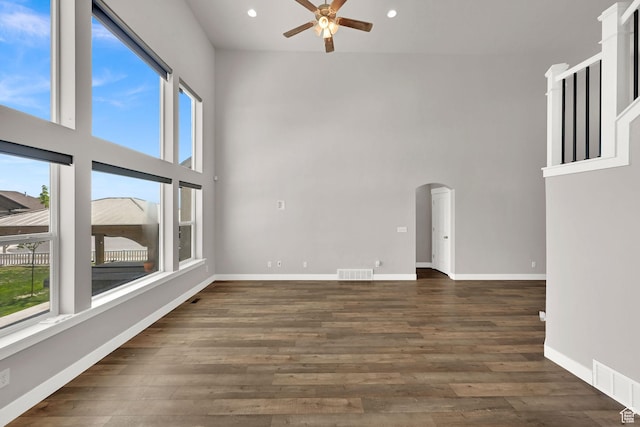 9602 N Blue Sky Dr, Eagle Mountain, UT 84005 - empty room with a ceiling fan, plenty of natural light, a high ceiling, arched walkways, and recessed lighting