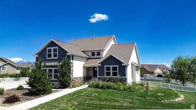 9602 N Blue Sky Dr, Eagle Mountain, UT 84005 - view of front facade with board and batten siding, a shingled roof, and stone siding