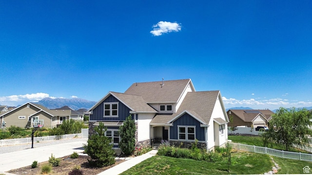 9602 N Blue Sky Dr, Eagle Mountain, UT 84005 - view of front of property featuring board and batten siding, stone siding, a shingled roof, and a residential view