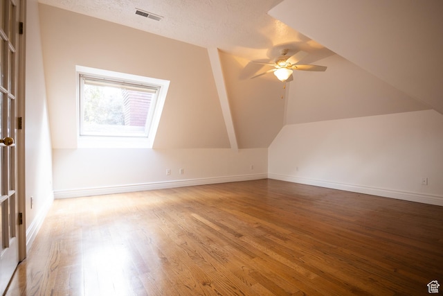 13251 S 1162 E, Draper, UT 84020 - bonus room featuring light wood-style floors, ceiling fan, vaulted ceiling, and a textured ceiling
