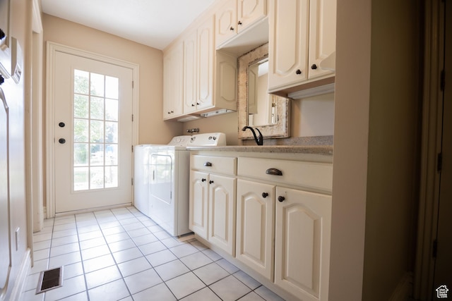 13251 S 1162 E, Draper, UT 84020 - laundry area with cabinet space, washer and dryer, and light tile patterned flooring