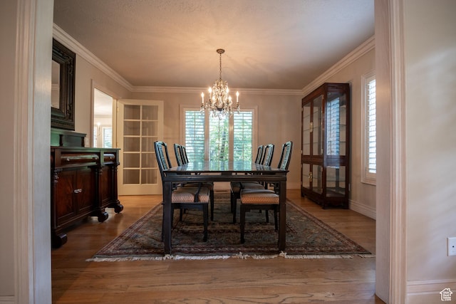 13251 S 1162 E, Draper, UT 84020 - dining space featuring a chandelier, healthy amount of natural light, wood finished floors, and ornamental molding