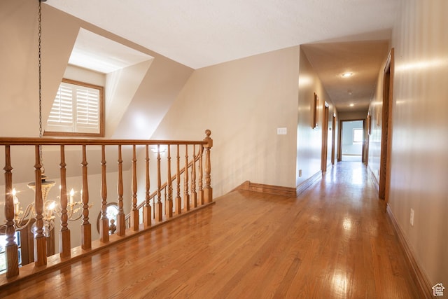 13251 S 1162 E, Draper, UT 84020 - hall with wood finished floors, an upstairs landing, and a chandelier