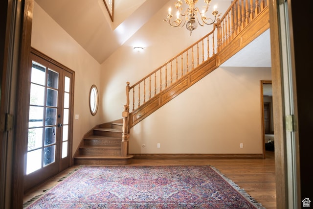 13251 S 1162 E, Draper, UT 84020 - stairway with wood finished floors, a chandelier, french doors, and high vaulted ceiling
