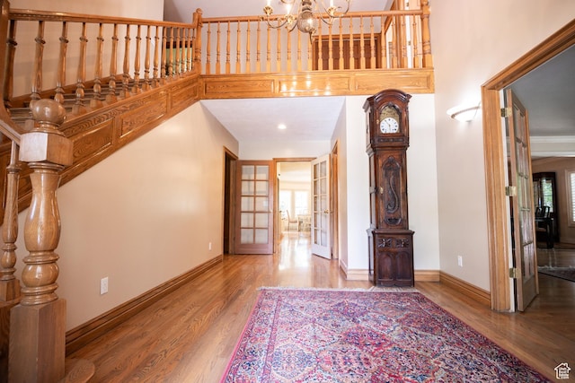 13251 S 1162 E, Draper, UT 84020 - foyer with wood finished floors, a chandelier, and a towering ceiling