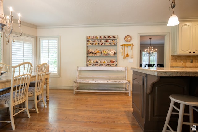 13251 S 1162 E, Draper, UT 84020 - dining space featuring a chandelier, ornamental molding, and light wood-style flooring
