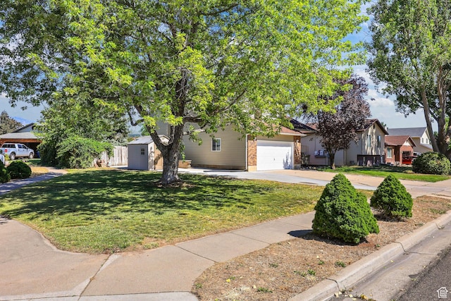155 N 1600 W, West Point, UT 84015 - view of property hidden behind natural elements featuring concrete driveway, a front lawn, a garage, and brick siding