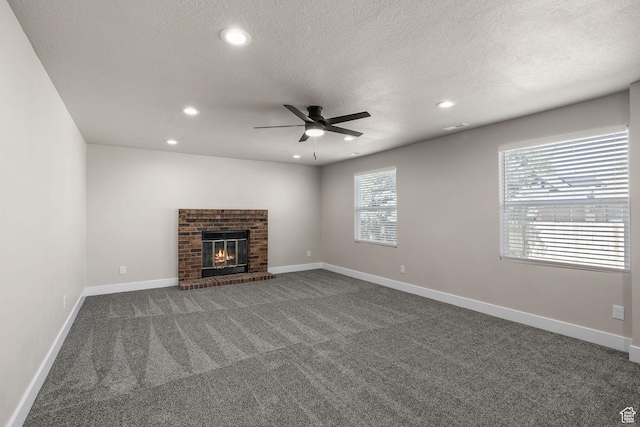 155 N 1600 W, West Point, UT 84015 - unfurnished living room featuring a ceiling fan, dark colored carpet, recessed lighting, a fireplace, and a textured ceiling
