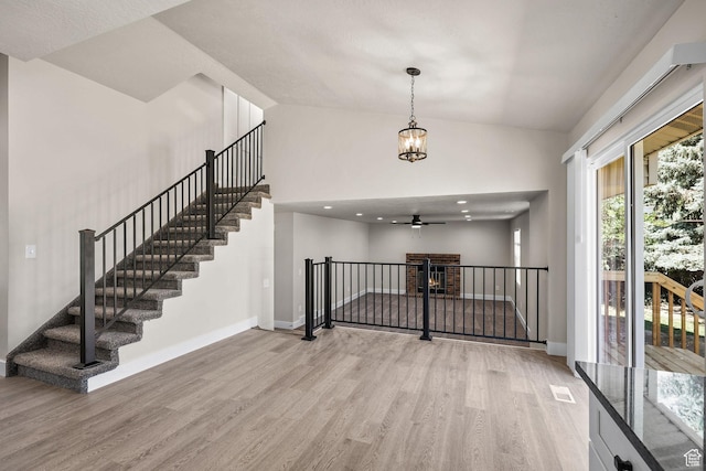 155 N 1600 W, West Point, UT 84015 - foyer with wood finished floors, a ceiling fan, stairs, high vaulted ceiling, and a chandelier
