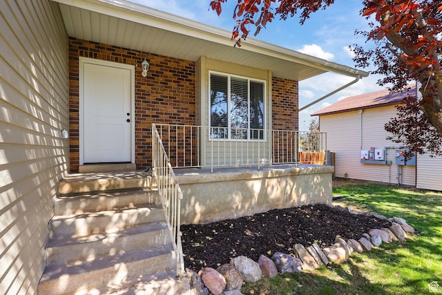 155 N 1600 W, West Point, UT 84015 - doorway to property with brick siding and a porch