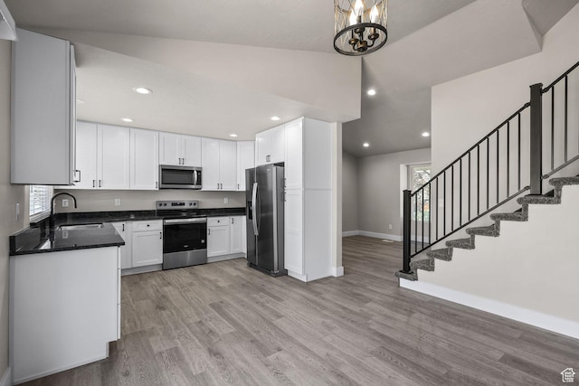 155 N 1600 W, West Point, UT 84015 - kitchen with stainless steel appliances, light wood-style floors, healthy amount of natural light, and recessed lighting
