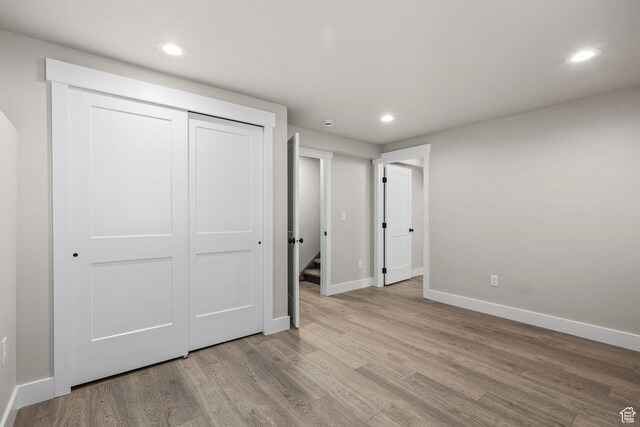 155 N 1600 W, West Point, UT 84015 - unfurnished bedroom featuring wood finished floors, recessed lighting, and a closet