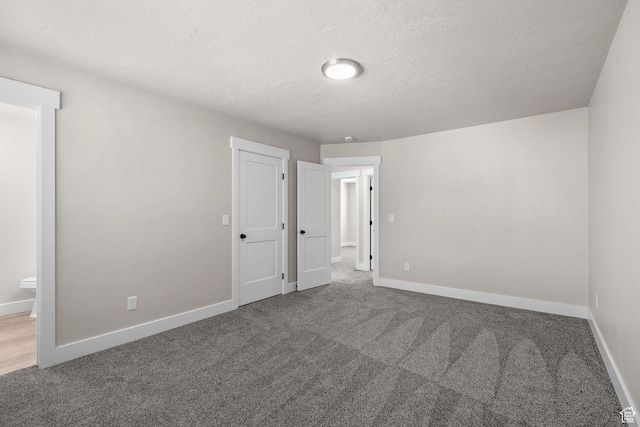 155 N 1600 W, West Point, UT 84015 - unfurnished bedroom featuring carpet, a textured ceiling, and ensuite bathroom