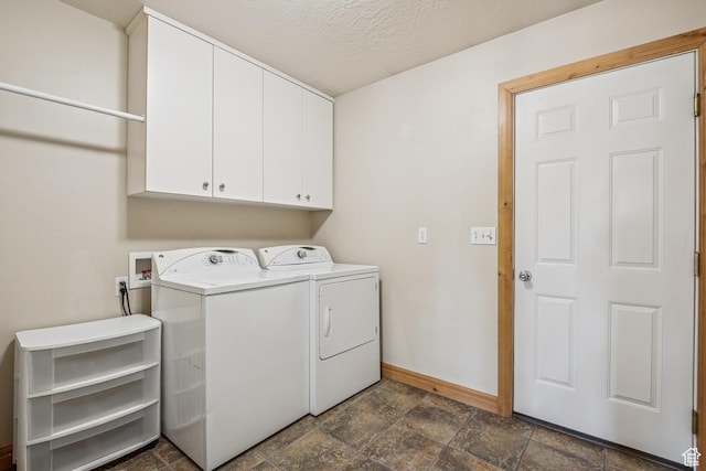 1516 S Lost Colt Dr, Heber City, UT 84032 - laundry room with cabinet space, dark stone finish floors, washing machine and clothes dryer, and a textured ceiling
