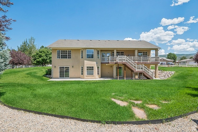 1516 S Lost Colt Dr, Heber City, UT 84032 - back of house featuring stairway, a patio, stucco siding, a deck, and a shingled roof