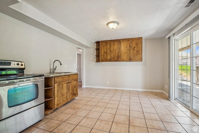1516 S Lost Colt Dr, Heber City, UT 84032 - kitchen with open shelves, stainless steel electric stove, brown cabinets, light tile patterned floors, and light stone countertops