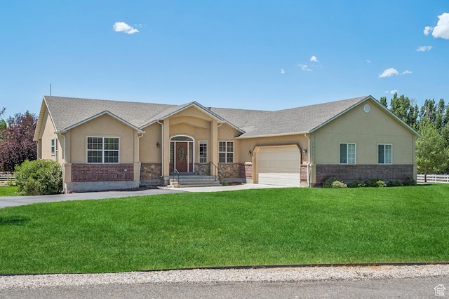 1516 S Lost Colt Dr, Heber City, UT 84032 - ranch-style house with an attached garage, stucco siding, concrete driveway, a front yard, and brick siding