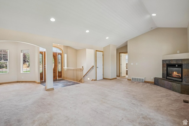 1516 S Lost Colt Dr, Heber City, UT 84032 - unfurnished living room with carpet floors, lofted ceiling, recessed lighting, and a tiled fireplace