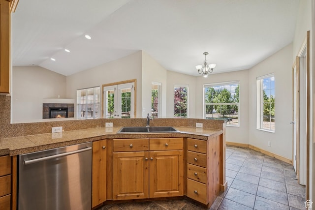 1516 S Lost Colt Dr, Heber City, UT 84032 - kitchen with tile counters, dishwasher, a chandelier, a tile fireplace, and recessed lighting