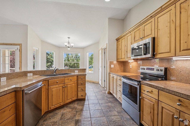 1516 S Lost Colt Dr, Heber City, UT 84032 - kitchen with stainless steel appliances, decorative backsplash, a chandelier, tile counters, and dark stone finish floors