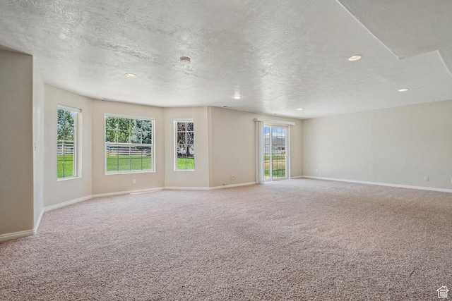 1516 S Lost Colt Dr, Heber City, UT 84032 - carpeted spare room with a textured ceiling, recessed lighting, and healthy amount of natural light