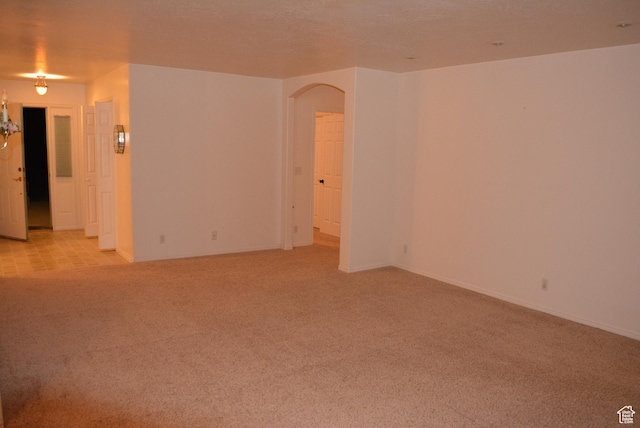 1452 N 3925 W, Marriott Slaterville, UT 84404 - spare room with arched walkways and light colored carpet