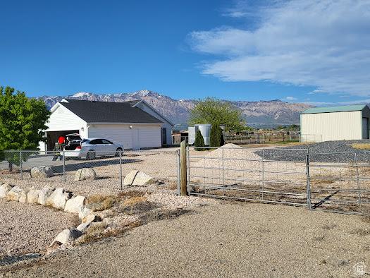 1452 N 3925 W, Marriott Slaterville, UT 84404 - view of yard featuring a mountain view and a garage