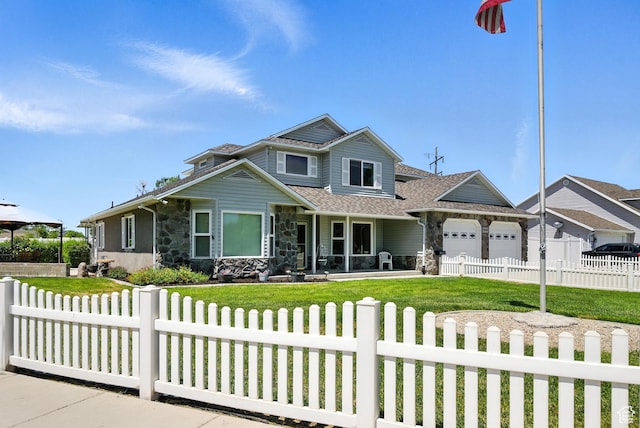 3036 S Dovetail Dr, West Valley City, UT 84128 - view of front of property featuring a fenced front yard, a garage, stone siding, covered porch, and roof with shingles