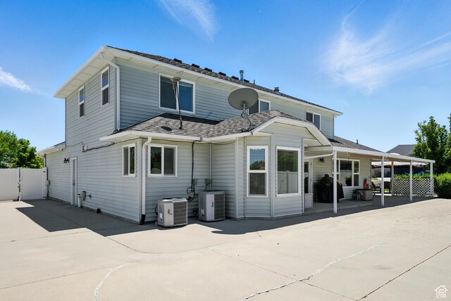 3036 S Dovetail Dr, West Valley City, UT 84128 - rear view of house with a patio and a shingled roof