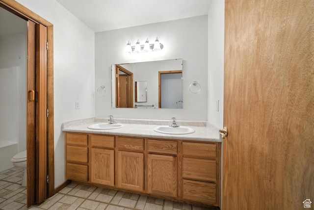 3036 S Dovetail Dr, West Valley City, UT 84128 - full bathroom with double vanity and toilet