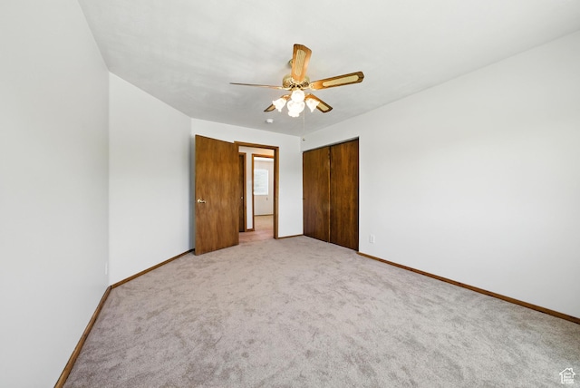 3036 S Dovetail Dr, West Valley City, UT 84128 - unfurnished bedroom featuring a closet, light carpet, and ceiling fan