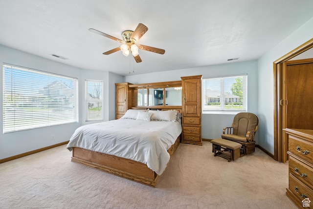 3036 S Dovetail Dr, West Valley City, UT 84128 - bedroom featuring light colored carpet and a ceiling fan