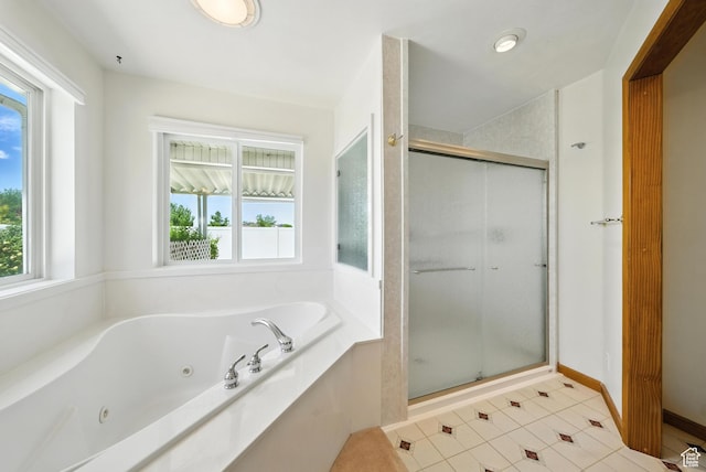 3036 S Dovetail Dr, West Valley City, UT 84128 - bathroom with a shower stall, healthy amount of natural light, and a whirlpool tub