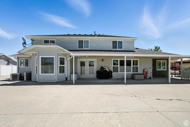 3036 S Dovetail Dr, West Valley City, UT 84128 - back of house featuring french doors, a patio, and a shingled roof
