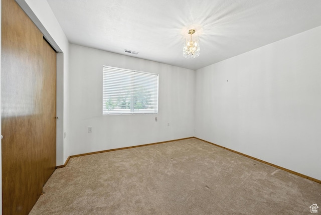 3036 S Dovetail Dr, West Valley City, UT 84128 - unfurnished bedroom featuring a chandelier, carpet, and a closet