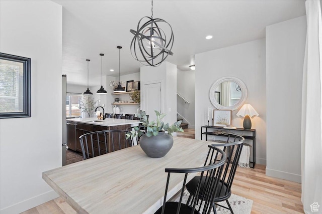 5137 W Stockfield Ln, Herriman, UT 84096 - dining area featuring stairway, a chandelier, light wood finished floors, and recessed lighting