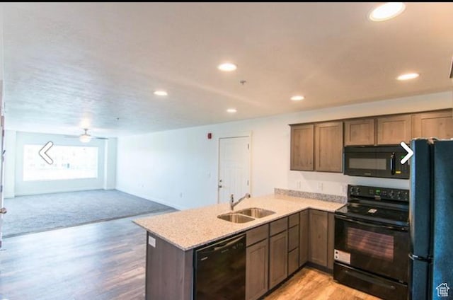 796 E 500 S, American Fork, UT 84003 - kitchen featuring black appliances, a peninsula, recessed lighting, light wood-style flooring, and open floor plan