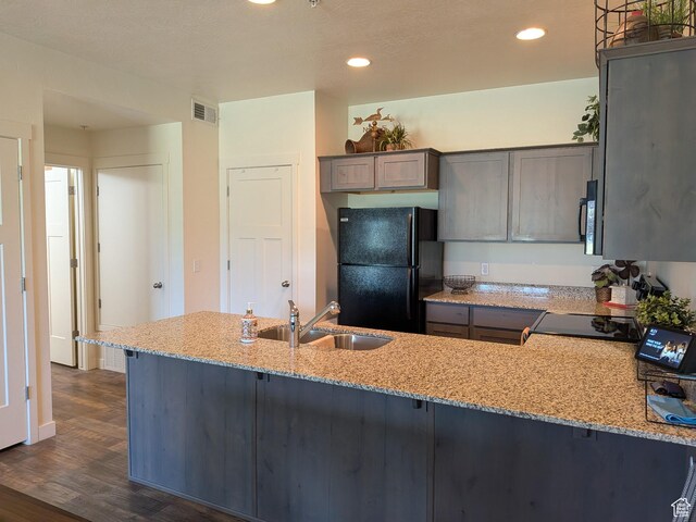 796 E 500 S, American Fork, UT 84003 - kitchen featuring black appliances, light stone counters, a peninsula, dark wood-style flooring, and recessed lighting