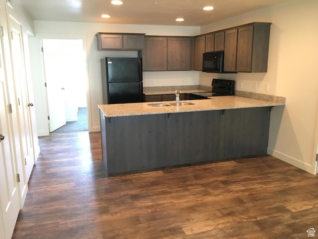796 E 500 S, American Fork, UT 84003 - kitchen featuring black appliances, a peninsula, recessed lighting, light stone counters, and dark wood-type flooring